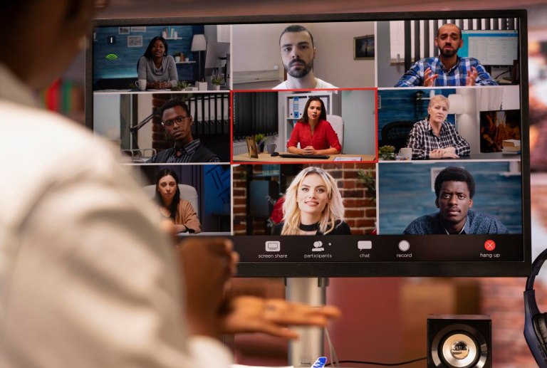A team meeting on a video call with remote team members